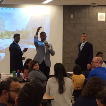 Principals from Jenner Academy for the Arts, center, and Ogden International School, right, speak to Ogden parents about a possible merger. The proposal would integrated a neighborhood public housing school for the first time in Chicago.